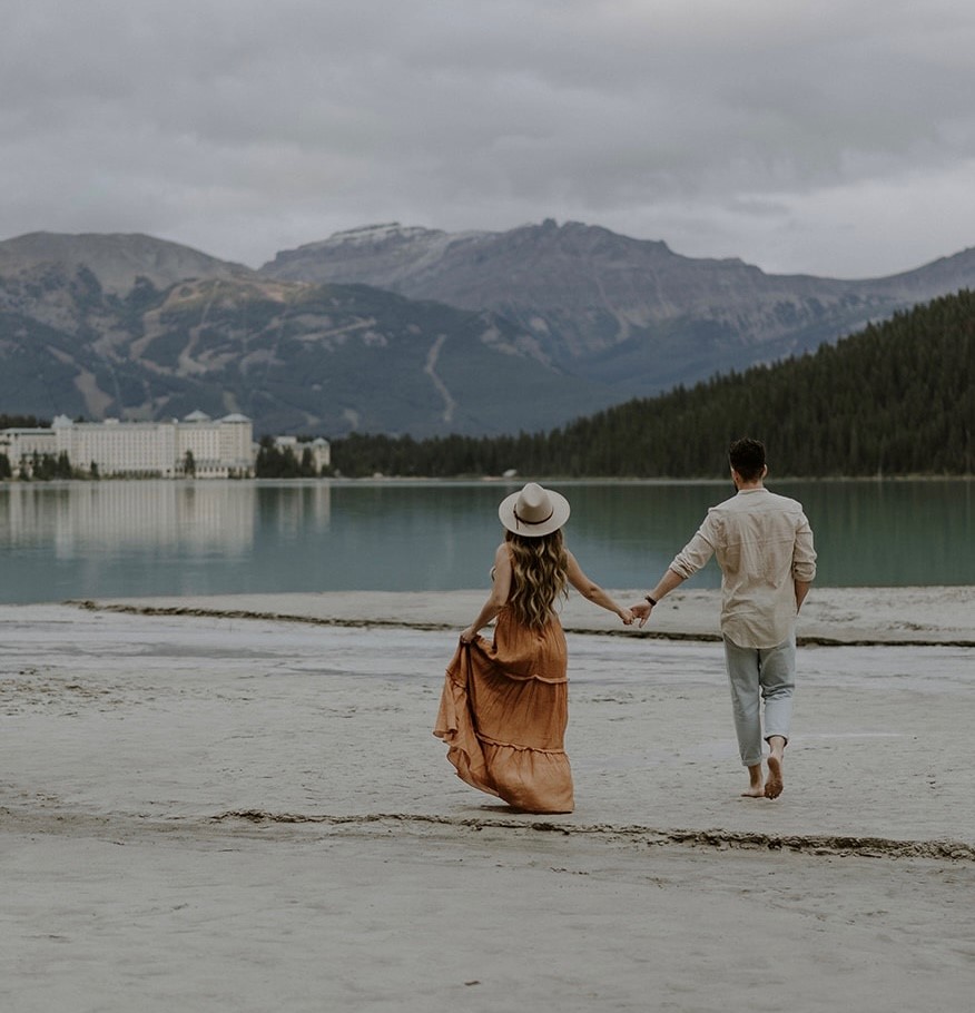 Man and Women Walking at Lake Louise